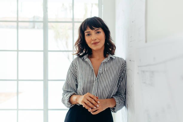 businesswoman standing in office. portrait of a confident businesswoman.